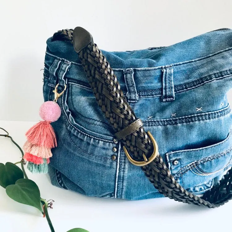 Upcycled denim hobo bag with retro floral print and braided strap