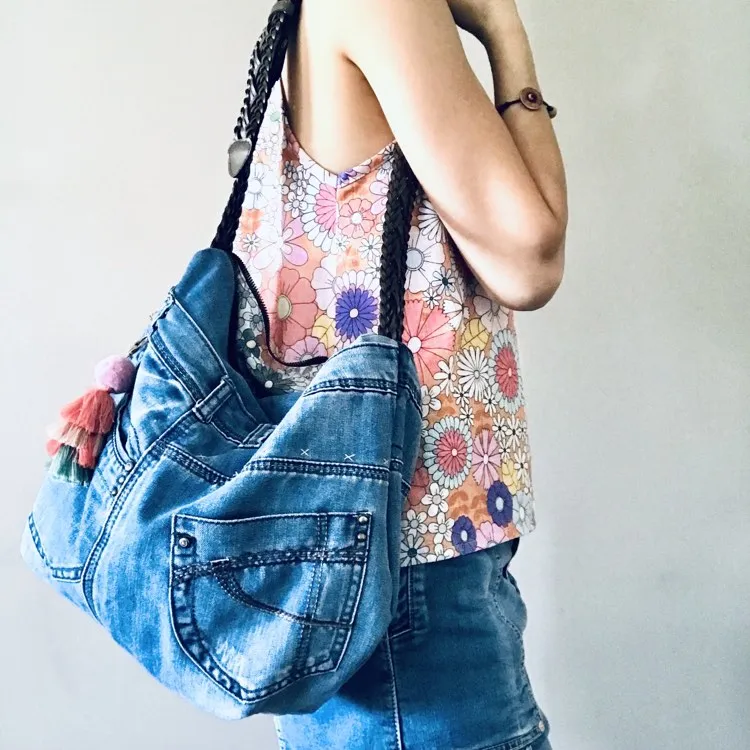 Upcycled denim hobo bag with retro floral print and braided strap