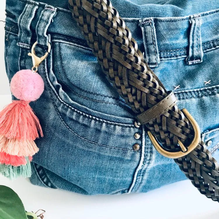 Upcycled denim hobo bag with retro floral print and braided strap