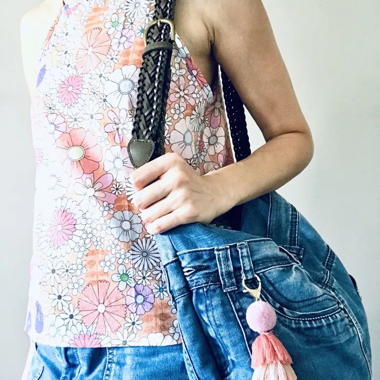 Upcycled denim hobo bag with retro floral print and braided strap