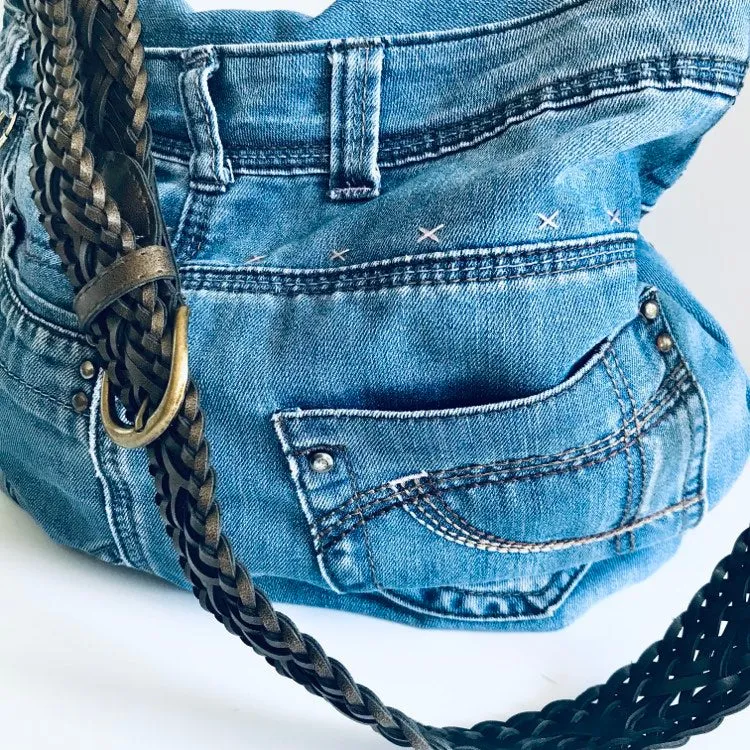 Upcycled denim hobo bag with retro floral print and braided strap